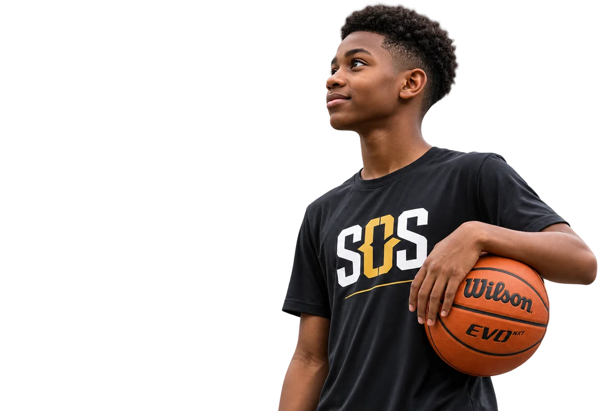 A School of Skill athlete looking ahead while holding a basketball