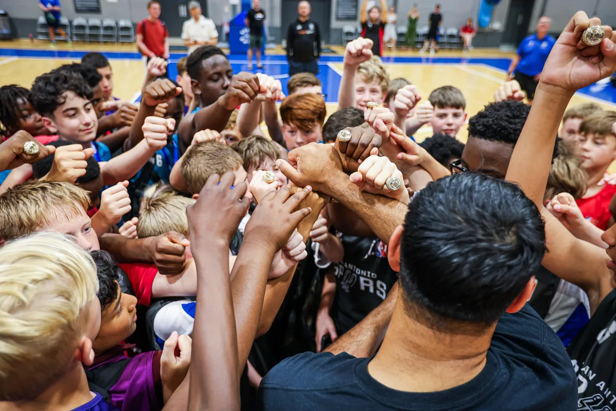 Young basketball players competing during a structured school programme